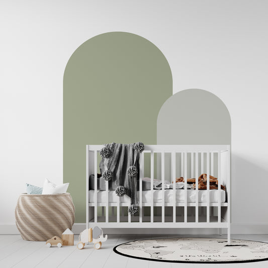Olive green arch wall decal creating a warm earthy feature wall in a modern nursery