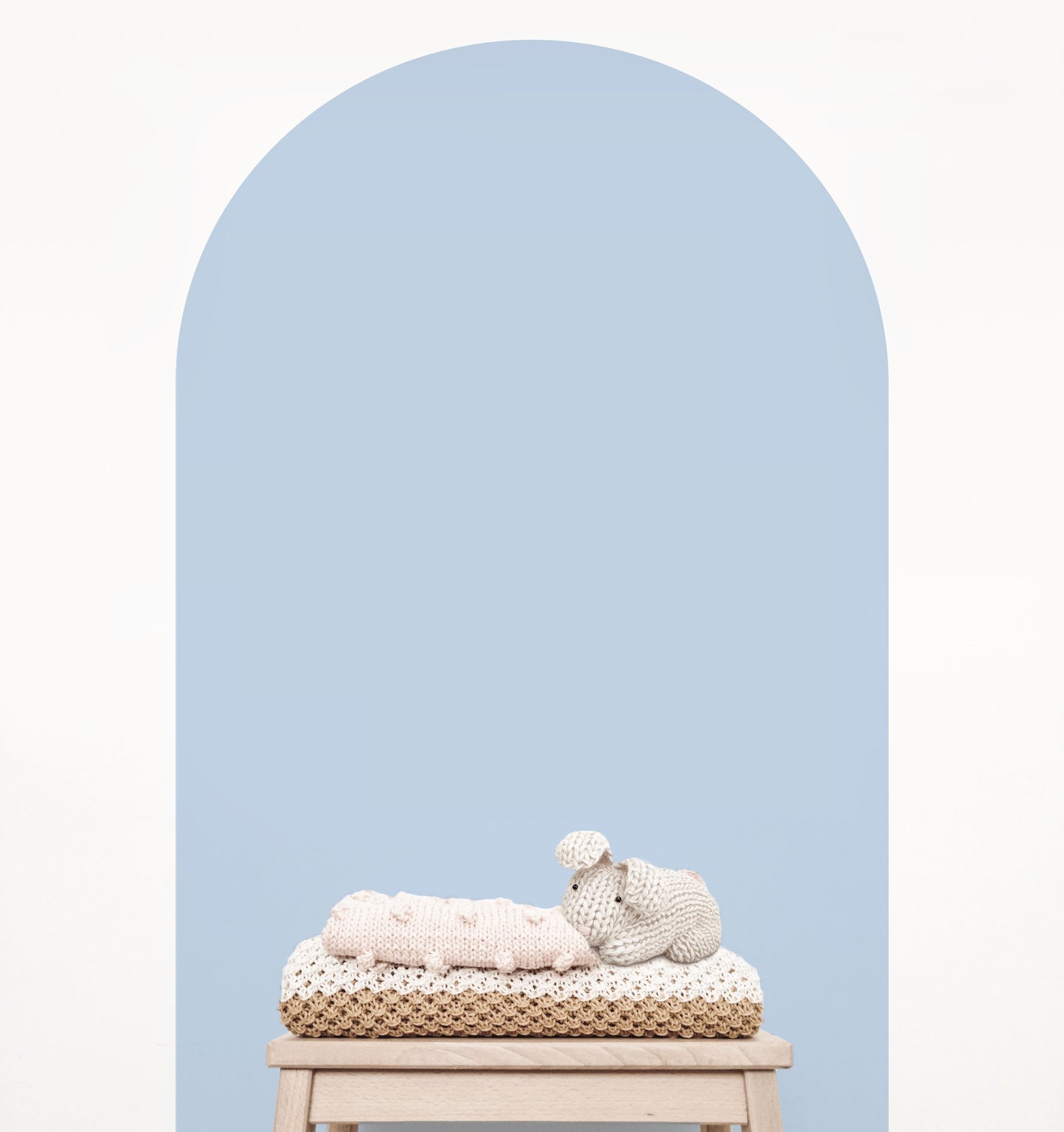 Baby blue arch wall decal creating a soft feature wall in a modern nursery