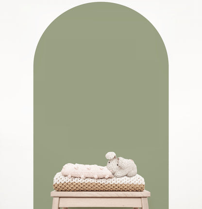 Olive green arch wall decal creating a warm earthy feature wall in a modern nursery