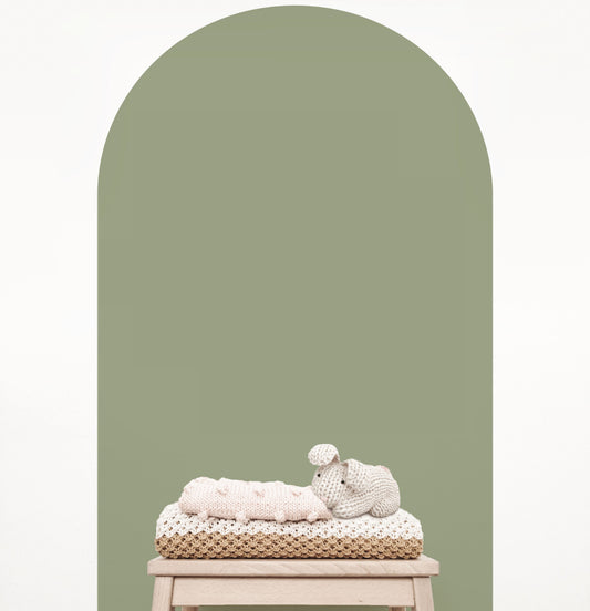 Olive green arch wall decal creating a warm earthy feature wall in a modern nursery