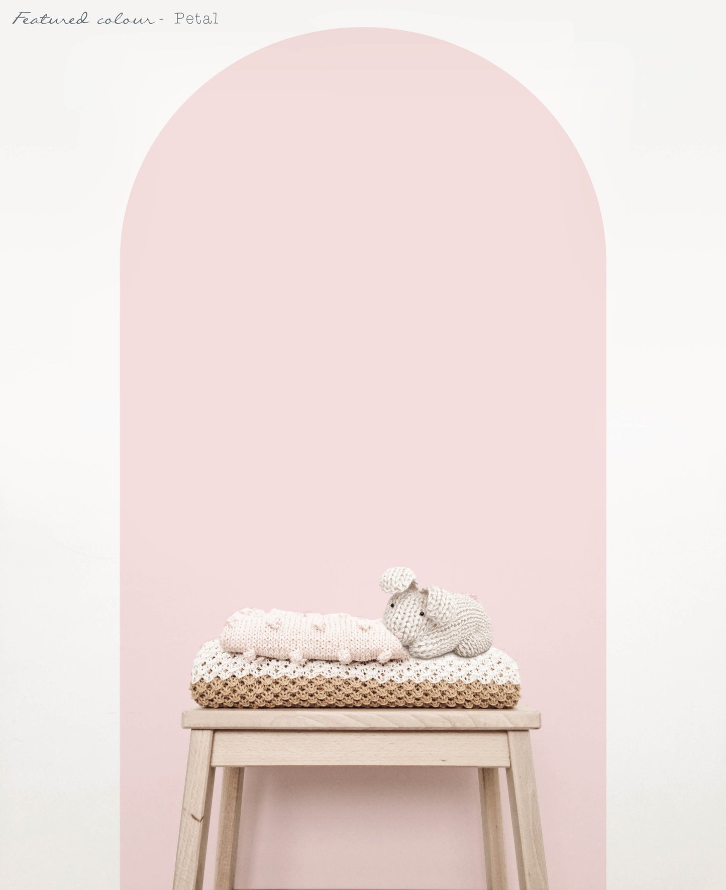 Pink arch wall decal in a close up view creating a soft feature wall