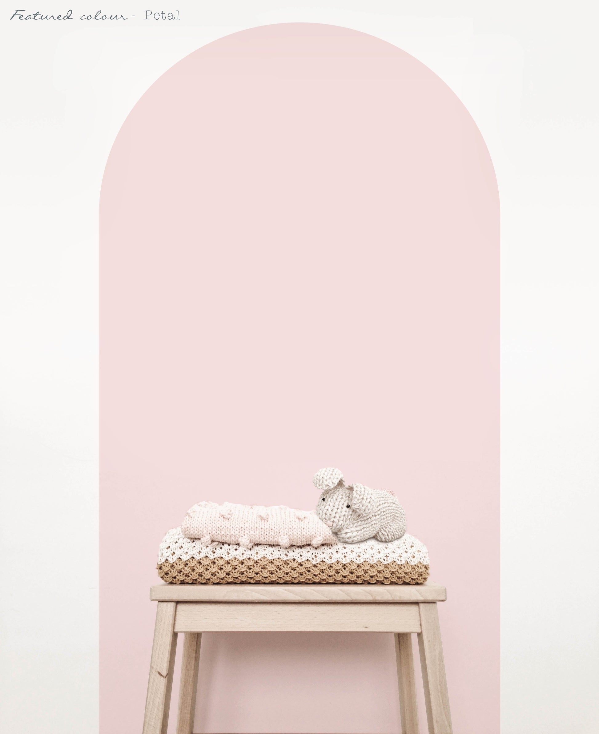 Pink arch wall decal in a close up view creating a soft feature wall