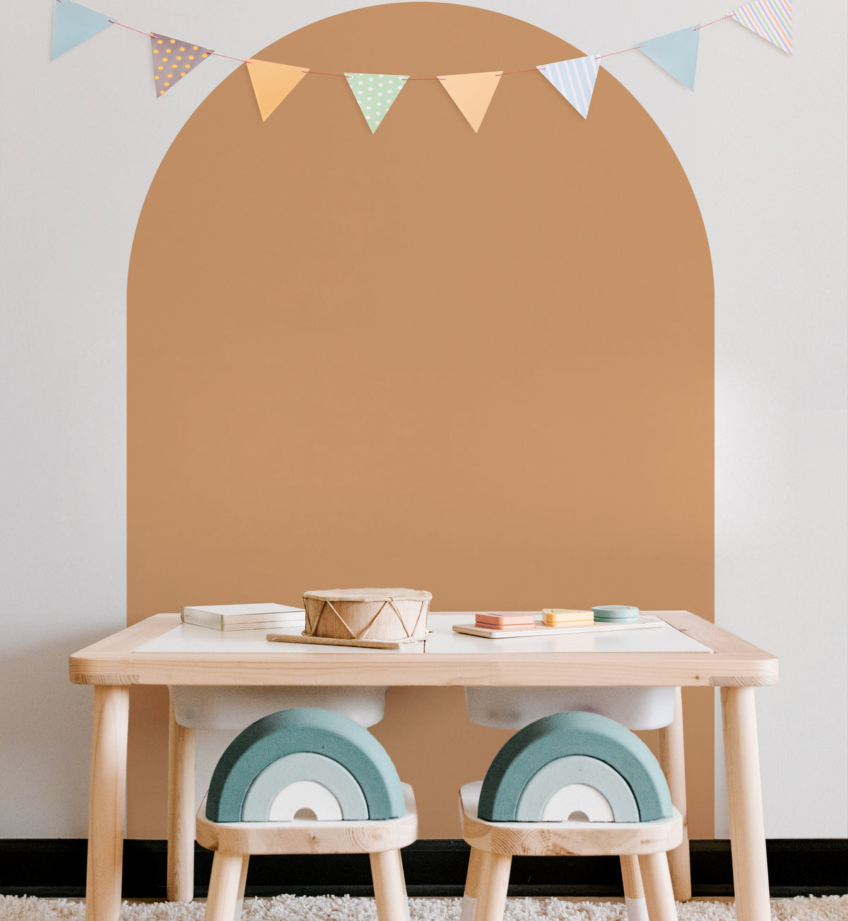 Rust arch wall decal creating a warm earthy feature wall in a modern nursery with ikea trofast table and chairs