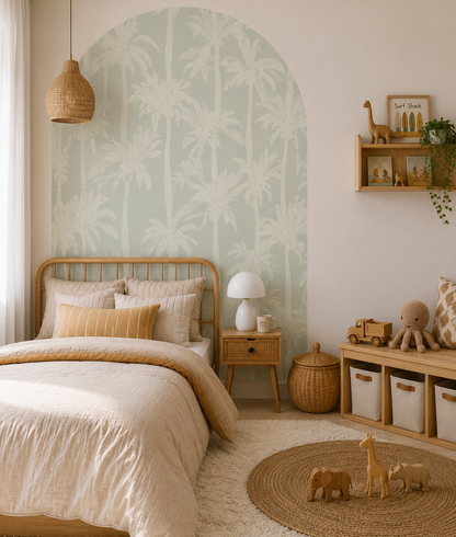 Sage Palms Arch Wall Decal behind a child's bed in a coastal nursery featuring soft sage tropical palm trees.
