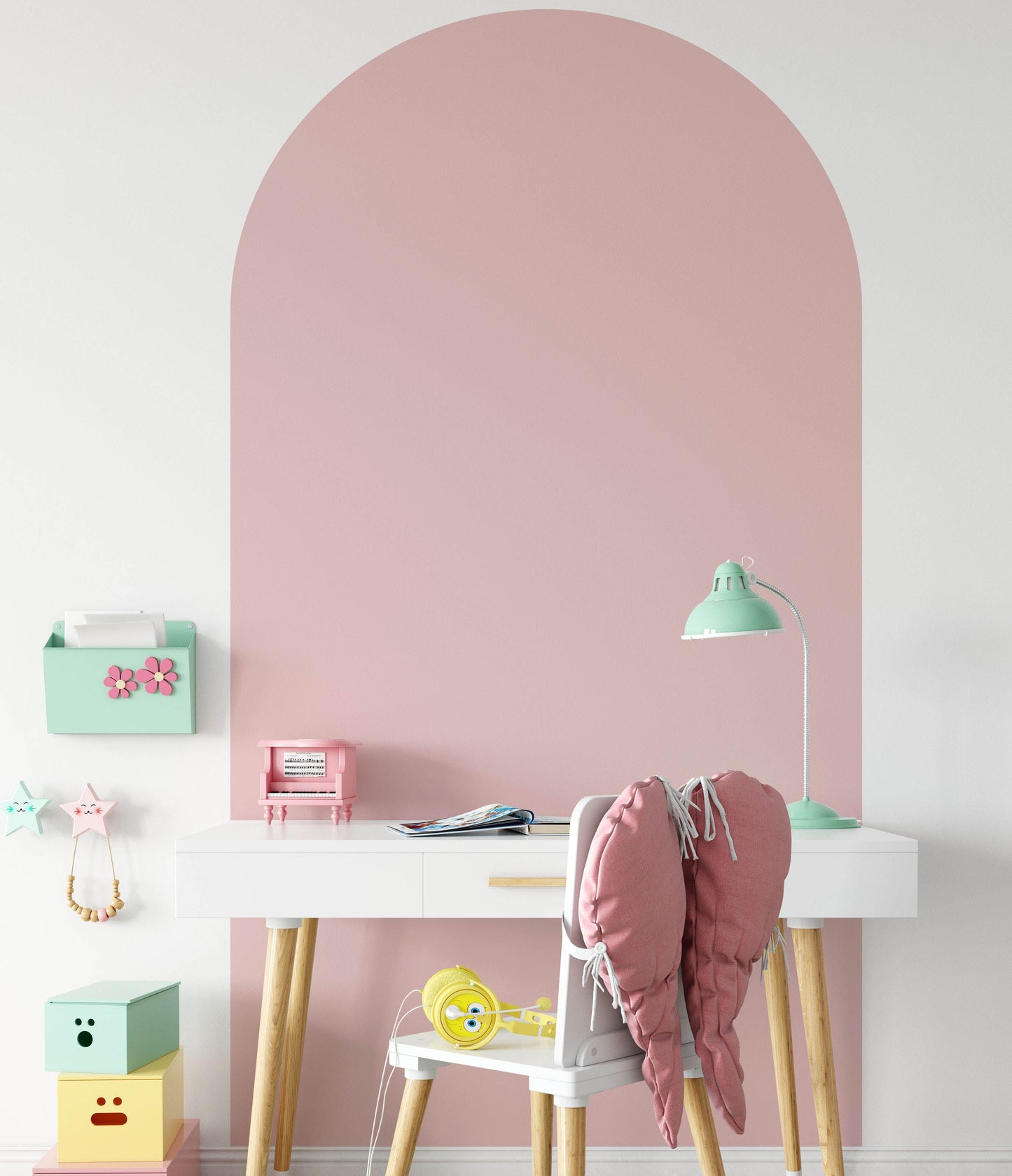 Blush pink arch wall decal creating a warm feature wall in a modern nursery