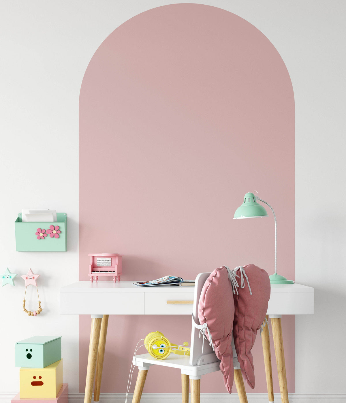Blush pink arch wall decal creating a warm feature wall in a modern nursery