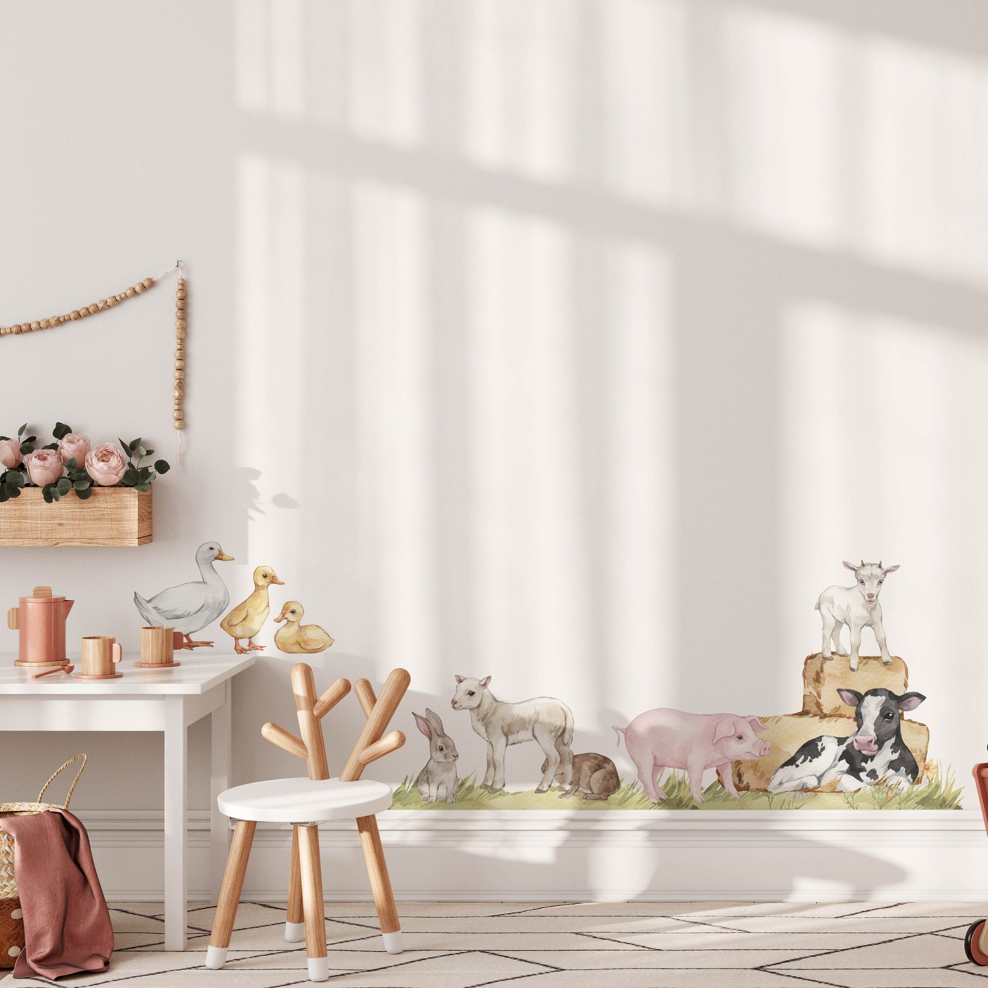 Farm animal wall stickers in a children's playroom with desk