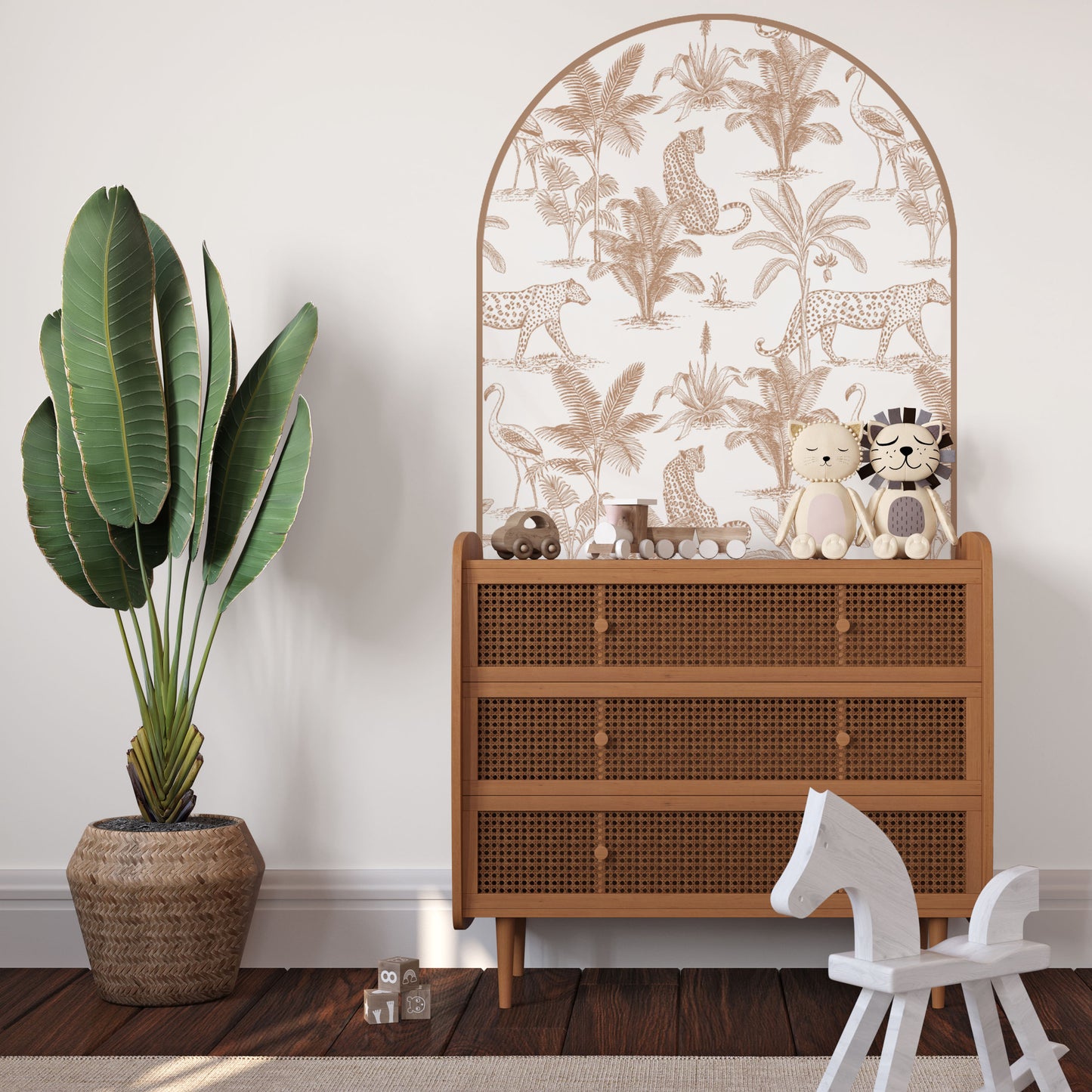 Clay Leopard Safari Arch Wall Decal behind a rattan bed in a modern safari nursery with removable fabric wall stickers
